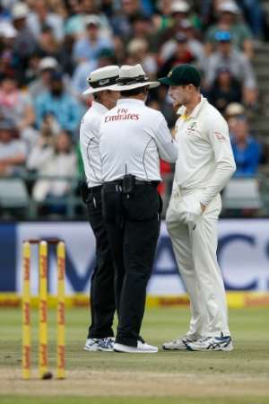 What's going on: Cameron Bancroft is quizzed by the umpires