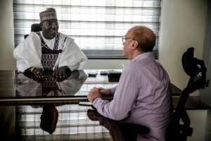 When he is not fulfilling his role as the Sarkin Fulani of Lagos, Mohammed Abubakar Bambado is a businessman, here meeting with a partner at his office in Apapa district. By Luis TATO (AFP)