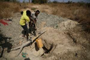 While some companies closed down operations, local miners have carried on working by themselves. By Kola Sulaimon (AFP)