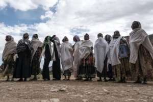 Women gather to mourn the victims of a massacre allegedly perpetrated by Eritrean soldiers in the village of Dengolat, north of Mekele, in February 2021. By EDUARDO SOTERAS (AFP/File)
