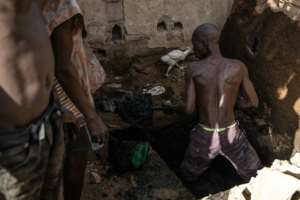 Work is done by hand -- latrine emptiers say protective gear often hampers them from doing their work in the hot, cramped conditions. By OLYMPIA DE MAISMONT (AFP)