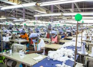 Workers assemble personal protective equipment for COVID-19 frontline health workers at a factory commissioned by the government, in Accra, Ghana. By Nipah Dennis (AFP)