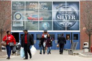Workers leave FCA Chrysler Warren Truck Assembly after the three Detroit automakers agreed to UAW demands to shut down all North America plants as a precaution against coronavirus. By JEFF KOWALSKY (AFP)
