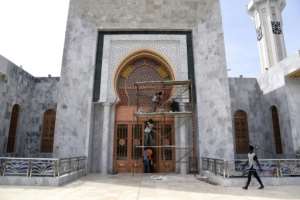 Workers this week put the finishing touches to the mosque before the long-awaited inauguration. By Seyllou (AFP)