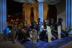 Young adherents to the order repeat religious verses at the centre. By MICHELE CATTANI (AFP/File)