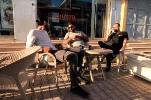Young men sit around at a pavement cafe in Benghazi, Libya's second largest city and once its joint capital. By Abdullah DOMA (AFP)