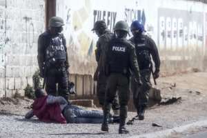 Zambian Defense Forces arrest a man in central Lusaka.  By MARCO LONGARI (AFP)