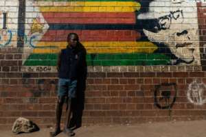 Zimbabweans have been divided over how to mourn a former leader once hailed as a liberation hero but who later brutally repressed his opponents. By Jekesai NJIKIZANA (AFP/File)