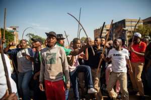 Zulu residents of the Jeppe Men Hostel in Johannesburg took to the streets of the city's business district in Tuesday's disturbances. By Michele Spatari (AFP)
