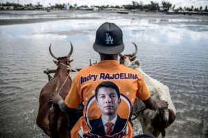 A man wears a t-shirt of Andry Rajoelina, who was running again for president after serving as head of state between 2009 and 2013.  By MARCO LONGARI (AFP/File)
