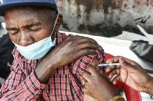 A man is inoculated with a Moderna Covid-19 vaccine in Nairobi on September 17, 2021.. By Simon MAINA (AFP/File)