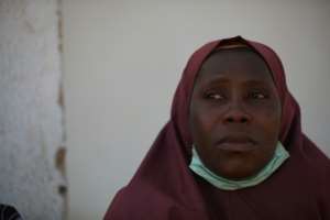 Vigil of a mother: a woman whose child was kidnapped waits at school.  By Kola Sulaimon (AFP)