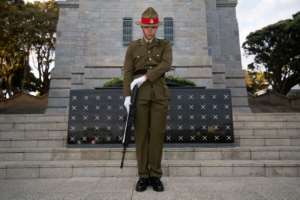 A New Zealand soldier stands guard during a Mounting of the Vigil and dressing of the Tomb of the Unknown Warrior at the National War Memorial in Wellington.  By Marty MELVILLE (AFP)
