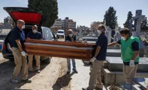 A burial in Spain, which along with Italy accounts for more than half of the world's coronavirus deaths. By BALDESCA SAMPER (AFP)