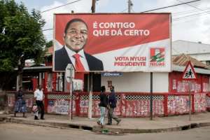 A billboard in Xai-Xai for President Filipe Nyusi, who is running for his second term in office in Tuesday's election. By GIANLUIGI GUERCIA (AFP)