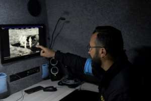 A Czech member of Frontex monitors the Albania-Greece border from inside a thermo-vision van that can detect bodies. By GENT SHKULLAKU (AFP)