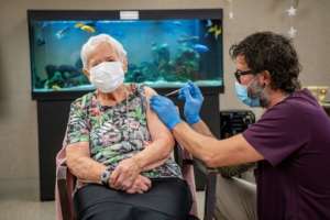 A nursing home resident in her 90s was the first to receive the Pfizer-BioNTech vaccine after it was approved by Swiss regulators.  By - (KEYSTONE / AFP)