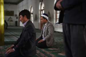 A Catholic NGO report on religious freedom says in China Uighur Muslims have been forbidden from observing Ramadan, Tibetan Buddhists face persecution and churches have been destroyed.  By Greg Baker (AFP/File)