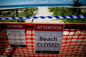 A closed sign at Coolangatta Beach on the Queensland - New South Wales border in Australia. By Patrick HAMILTON (AFP)