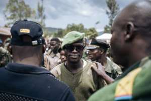A CODECO commander in Wadda village meets a delegation of former warlords sent to promote peace in volatile Ituri. By ALEXIS HUGUET (AFP)