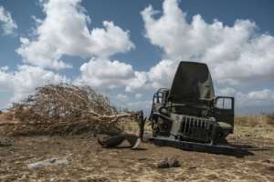 A damaged military truck belonging to Tigrayan forces lies abandoned in a field near Ayasu Gebriel, a village east of Alamata. By EDUARDO SOTERAS (AFP)