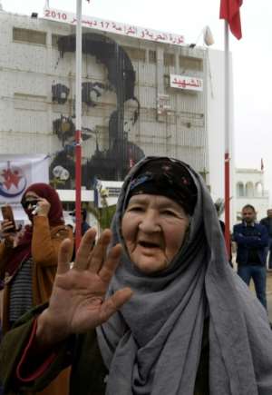 A December 17 picture shows commemorations 10 years after the self-immolation of Tunisian street vendor Mohamed Bouazizi at a square named in his honour in the central town of Sidi Bouzid. By FETHI BELAID (AFP/File)