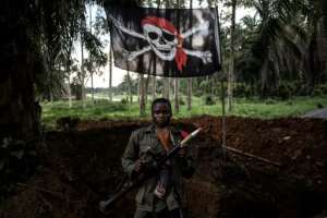 A DR Congo soldier at a military base, often targeted by the ADF militia in raids for weapons, ammunition and medical supplies. By JOHN WESSELS (AFP)