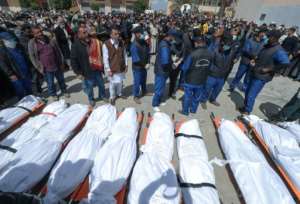 A funeral for 12 people found in mass graves in Tarhuna town, southeast of the capital. By Mahmud Turkia (AFP)