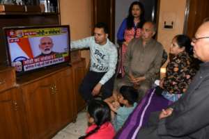 A family watches Indian Prime Minister Narendra Modi's address to the nation on television at their home in Amritsar. By NARINDER NANU (AFP)