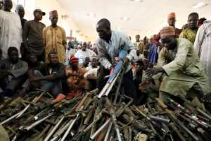 A farewell to arms? The Yansakai vigilante group surrendered hundreds of weapons last month. By Kola Sulaimon (AFP)
