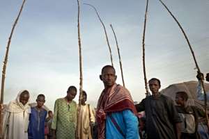 A group of Fulani men at a camp for Internal Displaced People in Bamako. More than 1,200 people who fled their villages in central Mali live at the camp, where conditions don't allow for social distancing or other preventative measures. By MICHELE CATTANI (AFP)