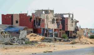 A July 9 picture shows a residential building in the south of Tripoli damaged during the 14 months of fighting between the GNA and forces loyal to Khalifa Haftar. By Mahmud TURKIA (AFP/File)