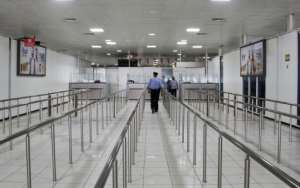 A Libyan policeman walks in the void of Mitiga International Airport in September of last year, when the facilities were closed by a series of clashes between militias. By Mahmud TURKIA (AFP / File)