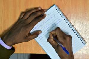 A pharmacist writes out a sample doping regimen. 'We do it for the money. In Kenya, you can do anything for money,' he said. By TONY KARUMBA (AFP)