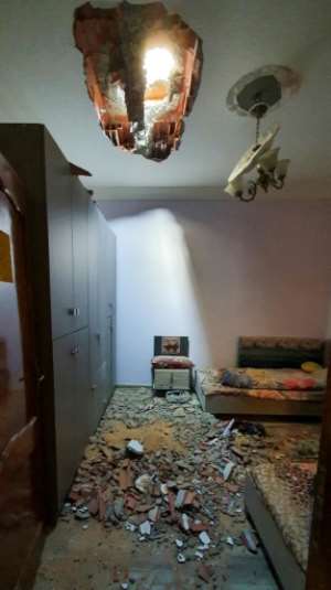A picture shows the debris inside a room following a rocket blast in Tripoli's southern district of Hadhba al-Badri on January 28. By Mahmud TURKIA (AFP/File)
