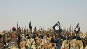 A picture released last May by Islamic State's Aamaq News Agency purporting to show fighters celebrating after an attack on an army patrol in Niger. Its authenticity cannot be verified. By HO (AAMAQ NEWS AGENCY/AFP)