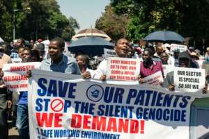 A protest march by doctors in Harare last December over the state of Zimbabwe's health service. The situation has become calamitous with the arrival of COVID-19, say experts. By Jekesai NJIKIZANA (AFP)