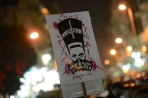 A protester at a 2013 rally in Cairo holds a placard pledging an 'uprising of women in the Arab world'. By Khaled DESOUKI (AFP/File)