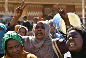 A Sudanese protester in Omdurman on November 21; street protests have continued despite a deal announced on Sunday to release the prime minister. By - (AFP)