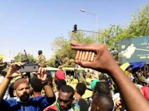A Sudanese protester outside army headquarters shows bullet cartridges he has collected -- the National Intelligence and Security Service and riot police have cracked down on demonstrators, but the army has not intervened. By STRINGER (AFP)
