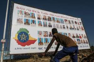 A sign lists members of the Tigray People's Liberation Front (TPLF) wanted by the Ethiopian Federal Police, as analysts warn the regional party could turn to insurgency-style warfare. By EDUARDO SOTERAS (AFP/File)