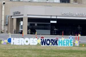 A sign praising health workers at Beaumont Hospital Royal Oak Campus in Royal Oak, Michigan. By JEFF KOWALSKY (AFP)