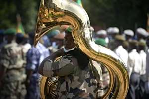 A soldier prepares to play in a parade for a ceremony to mark the 60th anniversary of Mali's independence in Bamako on Tuesday.  By MICHELE CATTANI (AFP)