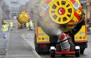 A truck disinfects the streets, as a preventive measure against the spread of the novel coronavirus, COVID-19, in Bogota, Colombia. By Raul ARBOLEDA (AFP)