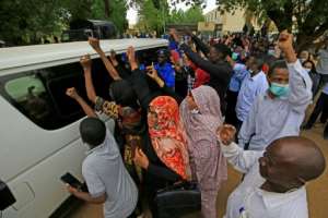 A vehicle carrying Bashir leaves the Khartoum courthouse in the Sudanese capital. By ASHRAF SHAZLY (AFP)