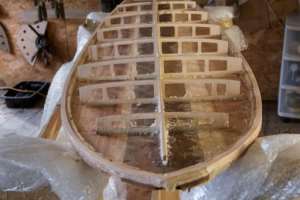 A wooden surfboard needs a sturdy skeleton to cope with the impact of the waves. By RODGER BOSCH (AFP)