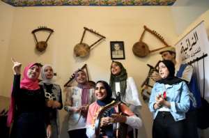 A year ago, Iman Haddo (C), started the Arab world's first all-female semsemia choir called Amwag (waves).. By Khaled DESOUKI (AFP)