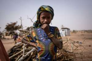 A young girl at a camp in Barsalogho, where 10,000 people have taken shelter from the violence. By OLYMPIA DE MAISMONT (AFP)