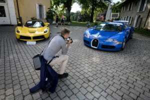 A 2015 Ferrari LaFerrari and a 2010 Bugatti Veyron EB 16.4 Coupe which belonged to Obiang before being seized. By FABRICE COFFRINI (AFP/File)