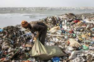 About 2,000 pickers ignore the stench and the fumes and make money by scavenging for plastic, iron and aluminium among the rubbish . By JOHN WESSELS (AFP)